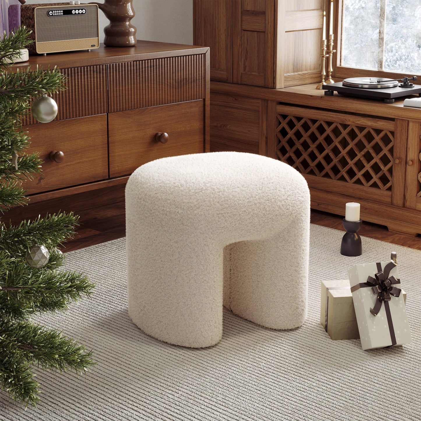Beige / white ottoman in a room with wooden furniture and a Christmas tree.