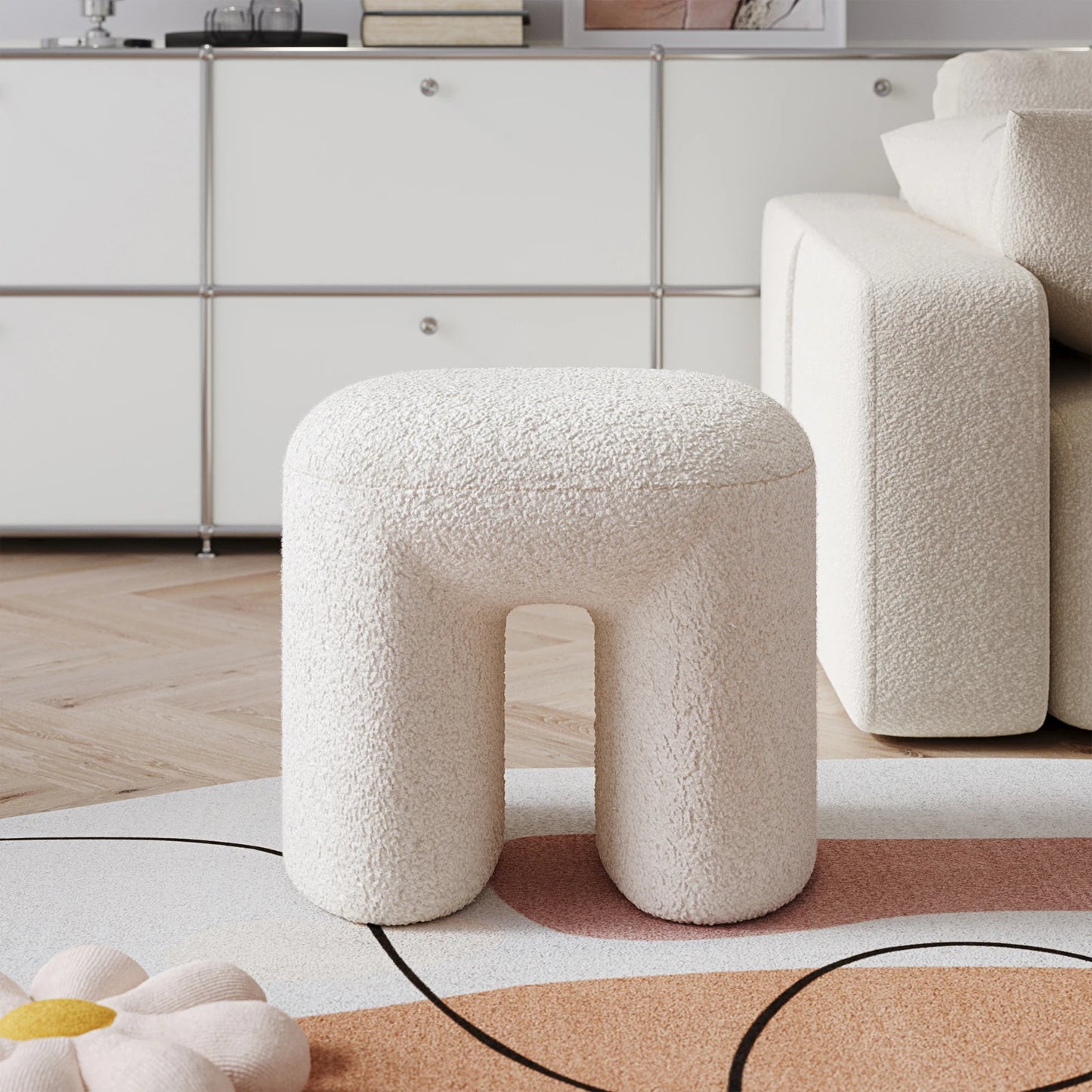 White teddy textured stool in a modern living room setting with a neutral color palette.