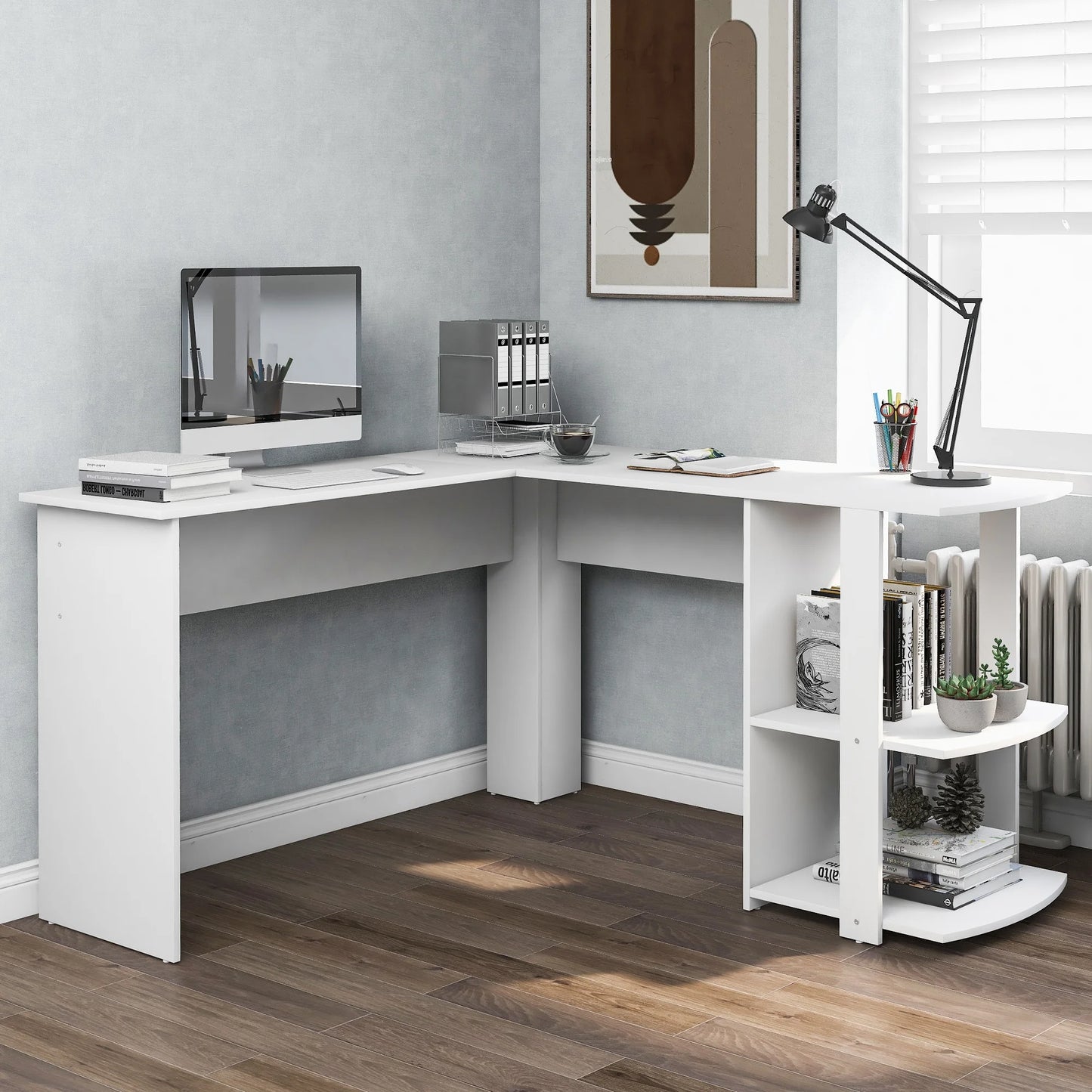 White L-shaped desk in a home office setting with books, a lamp, and decorative items.