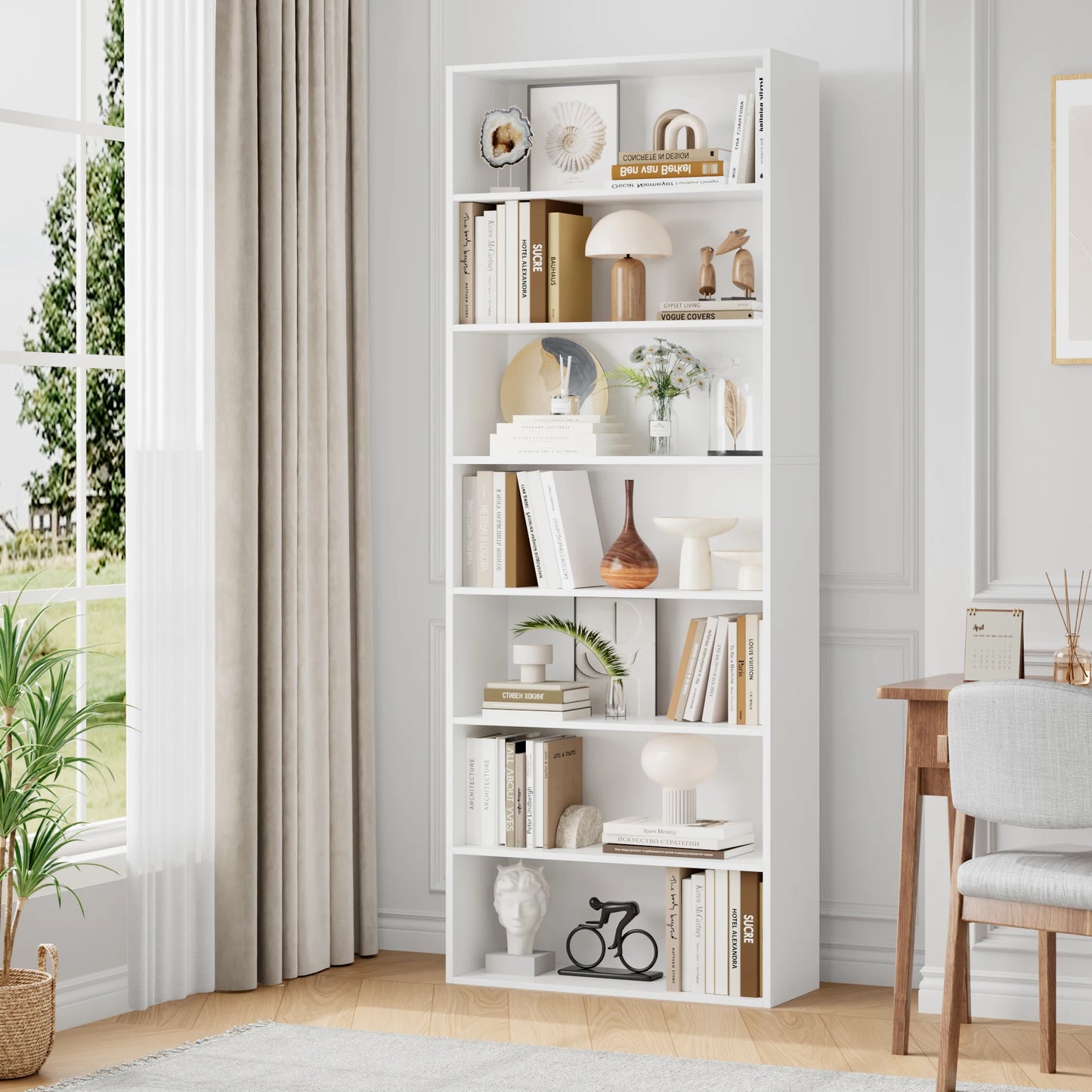 White bookshelf filled with books and decor in a room with a window and chair.