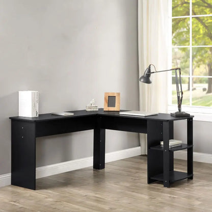 Black L-shaped desk in a room with a window and curtains. Gaming or office desk