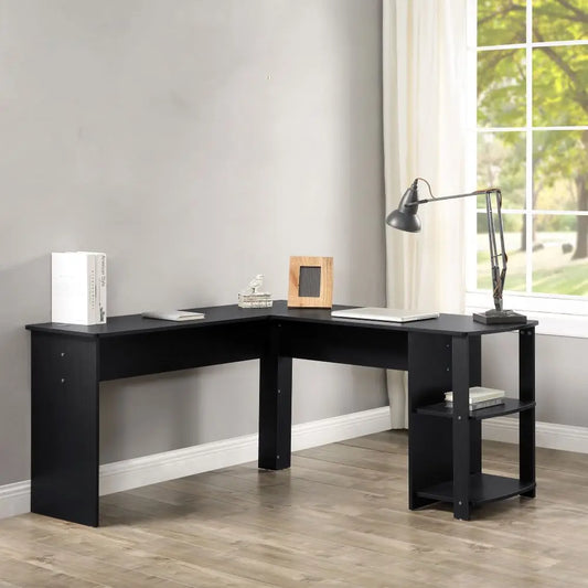 Black L-shaped desk in a room with a window and curtains. Gaming or office desk