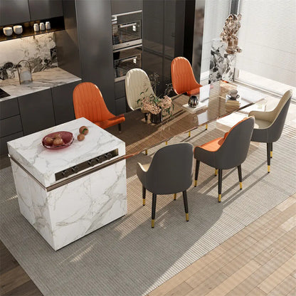 Modern kitchen with marble island and dining area with colorful chairs