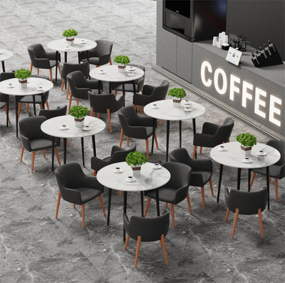 Coffee shop interior with tables, chairs, and a coffee machine.