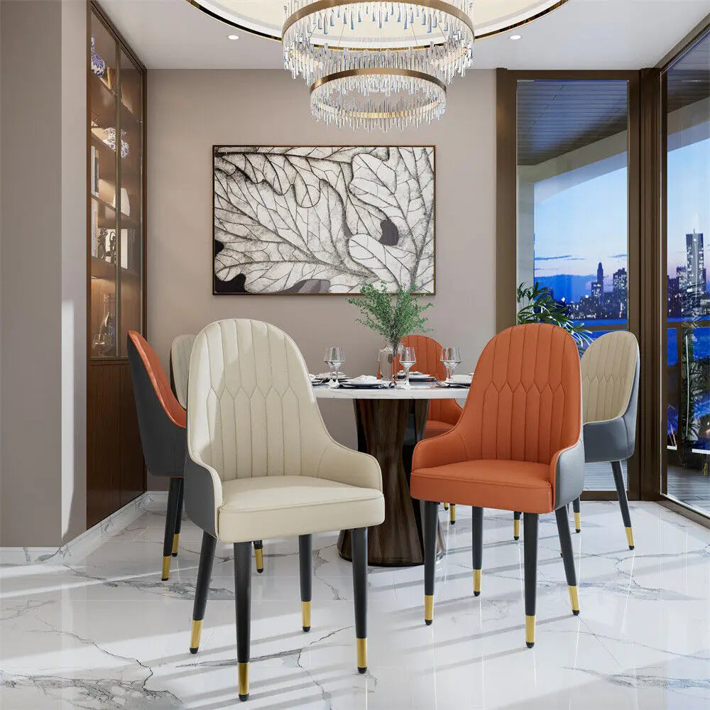 Modern dining room with orange and beige chairs, a round table, and cityscape view.