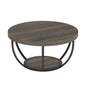 Round wooden grey and black coffee table with metal base on a white background