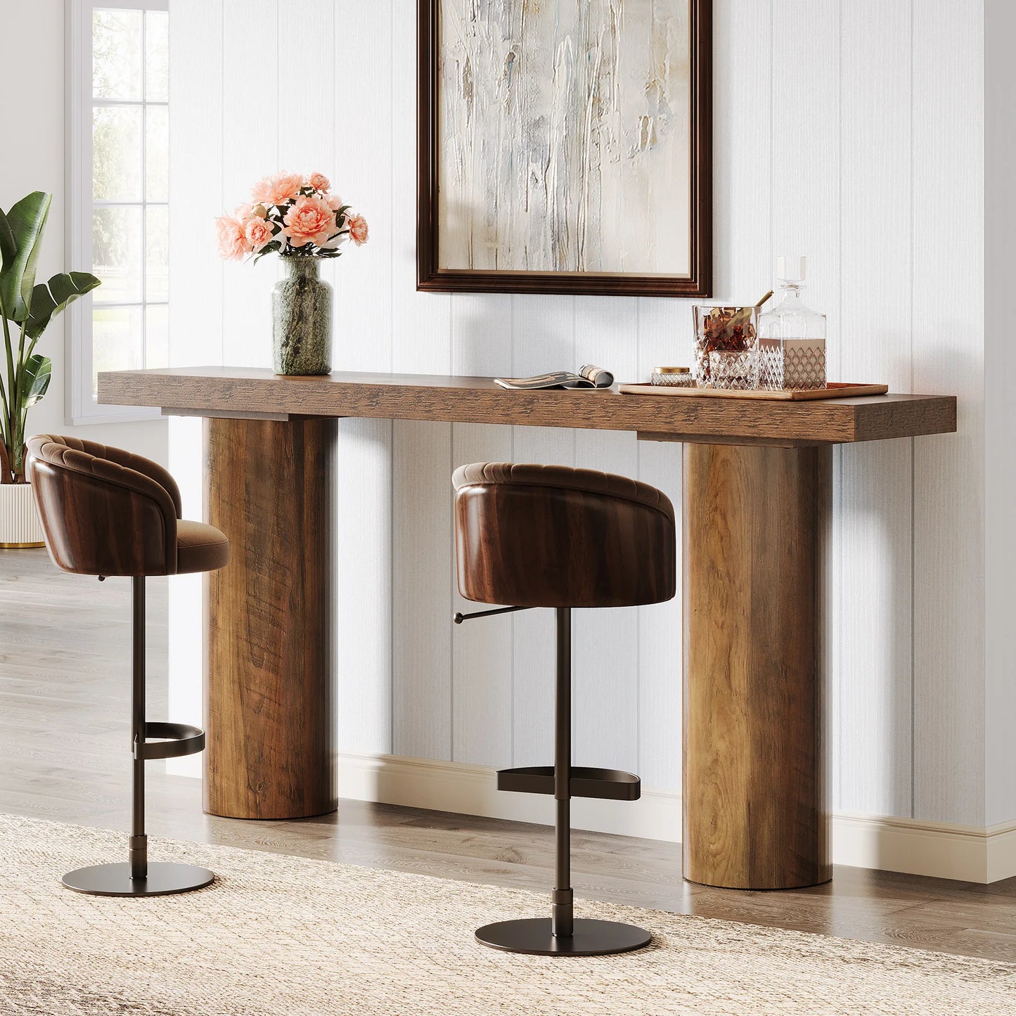 Wooden bar table with two bar stools in a room with a large mirror and decorative items.