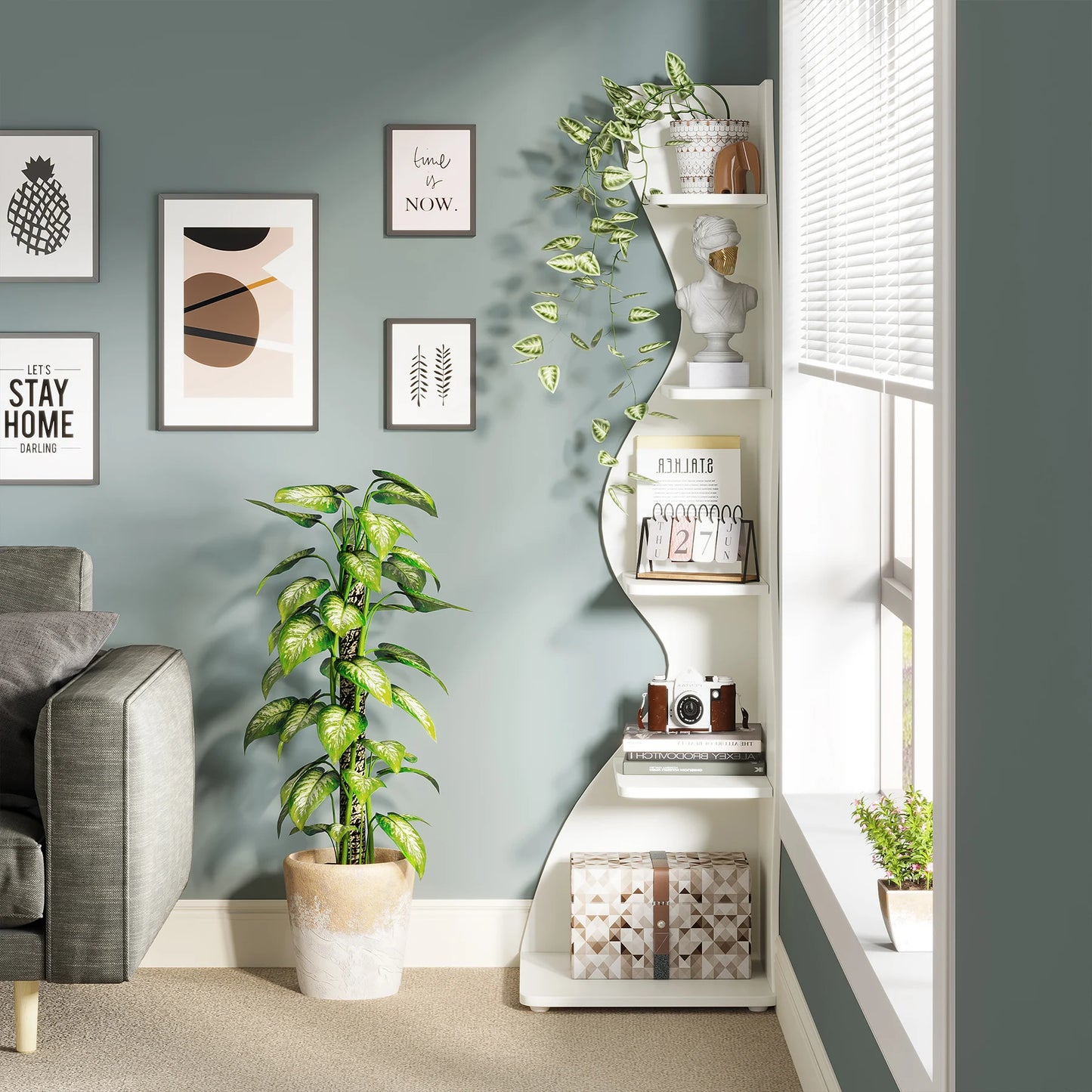 Modern living room with a white shelf, plant, and wall art.