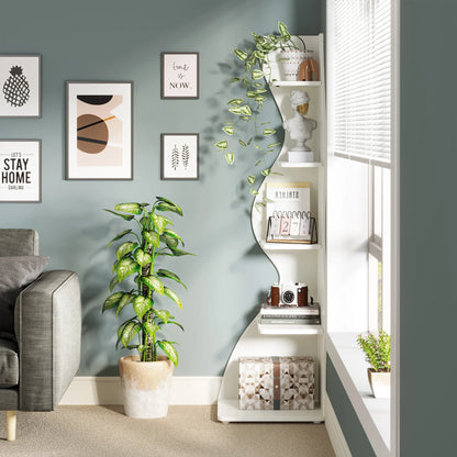 Modern living room with a white shelf, plant, and wall art.