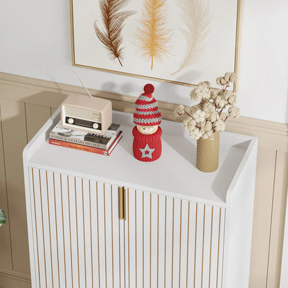 White cabinet with decorative items including a knitted doll, books, and a vase with dried flowers.
