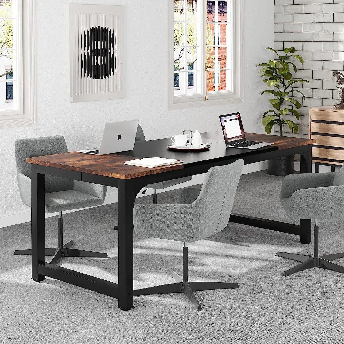 Modern office setup with wooden desk, gray chairs, and laptop on a gray carpeted floor.