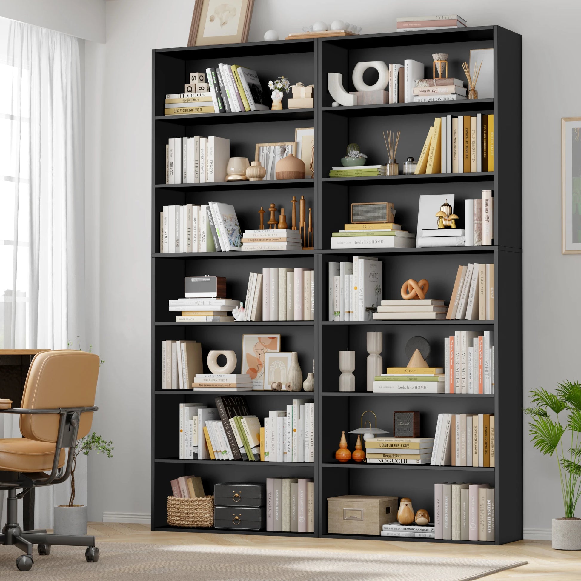 Black bookshelf filled with books and decorative items in a room with a chair and plants.