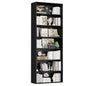 Black bookshelf with various decorative items on a white background