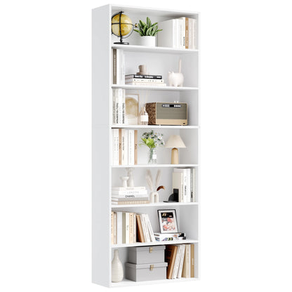 White bookshelf with various decorative items on a white background